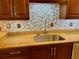 Stainless steel sink and granite countertops in this updated kitchen at 5405 Fair Oaks St # 5405, Bradenton, FL 34203