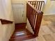 Wooden staircase leading to the second floor of the home at 5405 Fair Oaks St # 5405, Bradenton, FL 34203