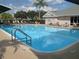 Inviting community pool with lounge chairs and clear water at 5405 Fair Oaks St # 5405, Bradenton, FL 34203