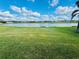 Landscaped backyard with lake view at 7926 111Th E Ter, Parrish, FL 34219