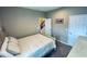 Bright bedroom with a full bed, and view of the upper floor at 7926 111Th E Ter, Parrish, FL 34219