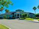 Exterior view of community center with palm trees and landscaping at 7926 111Th E Ter, Parrish, FL 34219