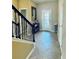 Bright entryway with tile flooring and a view of the staircase at 7926 111Th E Ter, Parrish, FL 34219