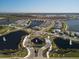 Aerial view of a luxury community with lakes, fountains, and upscale homes at 8372 Sea Glass Ct, Sarasota, FL 34240