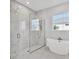 Modern bathroom with soaking tub and walk-in shower at 8372 Sea Glass Ct, Sarasota, FL 34240