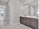 Elegant bathroom with double vanity and marble floors at 8372 Sea Glass Ct, Sarasota, FL 34240