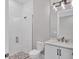 Modern bathroom with a walk-in shower and white vanity at 8372 Sea Glass Ct, Sarasota, FL 34240