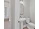 Simple half bathroom with pedestal sink and toilet at 8372 Sea Glass Ct, Sarasota, FL 34240