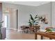 Elegant dining area with a glass table and leather chairs at 8372 Sea Glass Ct, Sarasota, FL 34240