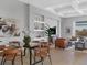 Modern dining room with glass top table and leather chairs at 8372 Sea Glass Ct, Sarasota, FL 34240