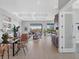 Open dining area with modern glass table and leather chairs at 8372 Sea Glass Ct, Sarasota, FL 34240