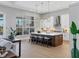 Spacious kitchen featuring an island, white cabinetry and stainless steel appliances at 8372 Sea Glass Ct, Sarasota, FL 34240