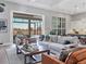 Living room with open floor plan and views of the pool at 8372 Sea Glass Ct, Sarasota, FL 34240