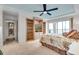 Bedroom with built-in shelving and TV at 9393 Midnight Pass Rd # 201, Sarasota, FL 34242