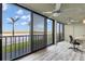 Home office with water views and sliding doors to balcony at 9393 Midnight Pass Rd # 201, Sarasota, FL 34242