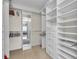 Spacious walk-in closet with ample shelving and hanging space at 9393 Midnight Pass Rd # 201, Sarasota, FL 34242