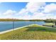 Peaceful waterfront lawn with seating area, offering tranquil views at 9393 Midnight Pass Rd # 201, Sarasota, FL 34242