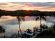 Stunning waterfront view at sunset with boats docked at 9393 Midnight Pass Rd # 201, Sarasota, FL 34242