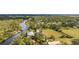 Aerial view showcasing riverfront home and expansive land at 1285 & 1289 Hagle Park Rd, Bradenton, FL 34212