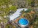 Aerial view of home with pool and lush landscaping at 1285 & 1289 Hagle Park Rd, Bradenton, FL 34212