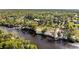 Aerial view of riverfront property with lush vegetation at 1285 & 1289 Hagle Park Rd, Bradenton, FL 34212