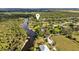 Aerial view showing home's location on waterfront property with lush vegetation at 1285 & 1289 Hagle Park Rd, Bradenton, FL 34212