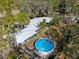 Aerial view of home with pool and lush landscaping at 1285 & 1289 Hagle Park Rd, Bradenton, FL 34212