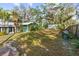 Large backyard with stone pathway and lush trees at 1285 & 1289 Hagle Park Rd, Bradenton, FL 34212