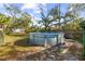 Above ground pool in backyard with surrounding trees at 1285 & 1289 Hagle Park Rd, Bradenton, FL 34212