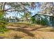 Expansive backyard, showing home exterior and pool at 1285 & 1289 Hagle Park Rd, Bradenton, FL 34212