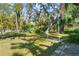 Spacious backyard with large oak tree and swing at 1285 & 1289 Hagle Park Rd, Bradenton, FL 34212