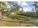 Spacious backyard with stepping stones and lush greenery at 1285 & 1289 Hagle Park Rd, Bradenton, FL 34212