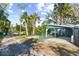 Covered carport with a grassy area at 1285 & 1289 Hagle Park Rd, Bradenton, FL 34212