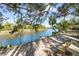 Scenic river view with sandy bank and seating area at 1285 & 1289 Hagle Park Rd, Bradenton, FL 34212