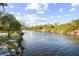 Serene river view with lush vegetation along the waterway at 1285 & 1289 Hagle Park Rd, Bradenton, FL 34212