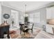 Casual dining area with glass-top table and four chairs, in a sunlit space at 13325 Indigo Way, Bradenton, FL 34211