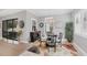 Bright dining area with glass table and four chairs, near sliding doors at 13325 Indigo Way, Bradenton, FL 34211