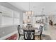 Charming dining area with a glass table and four chairs, near kitchen at 13325 Indigo Way, Bradenton, FL 34211