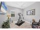 Home gym with elliptical machine and relaxing seating at 13325 Indigo Way, Bradenton, FL 34211