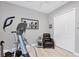 Home gym featuring an elliptical and comfortable chair at 13325 Indigo Way, Bradenton, FL 34211