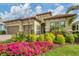 Two-story house with two-car garage, landscaping, and palm trees at 13325 Indigo Way, Bradenton, FL 34211