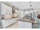 Bright kitchen featuring white cabinets, stainless steel appliances, and granite countertops at 13325 Indigo Way, Bradenton, FL 34211