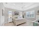 Spacious main bedroom with a ceiling fan and large windows at 13325 Indigo Way, Bradenton, FL 34211