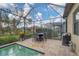 Covered patio with pool, table and chairs, great for entertaining at 13325 Indigo Way, Bradenton, FL 34211