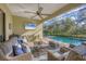 Relaxing pool area with covered patio, seating, and a flat screen TV at 13325 Indigo Way, Bradenton, FL 34211