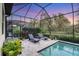 Peaceful screened-in pool area at dusk at 13325 Indigo Way, Bradenton, FL 34211