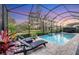 Enclosed pool and patio at sunset at 13325 Indigo Way, Bradenton, FL 34211