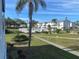 Aerial view showcases the community pool, landscaping, and buildings at 2227 Sunset Dr # E-22, Bradenton, FL 34207