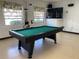 Spacious game room with a pool table and TV at 2227 Sunset Dr # E-22, Bradenton, FL 34207