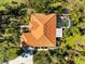 Aerial view showcasing home's roofline, pool, and landscape at 3901 Balsam Ct, Sarasota, FL 34243